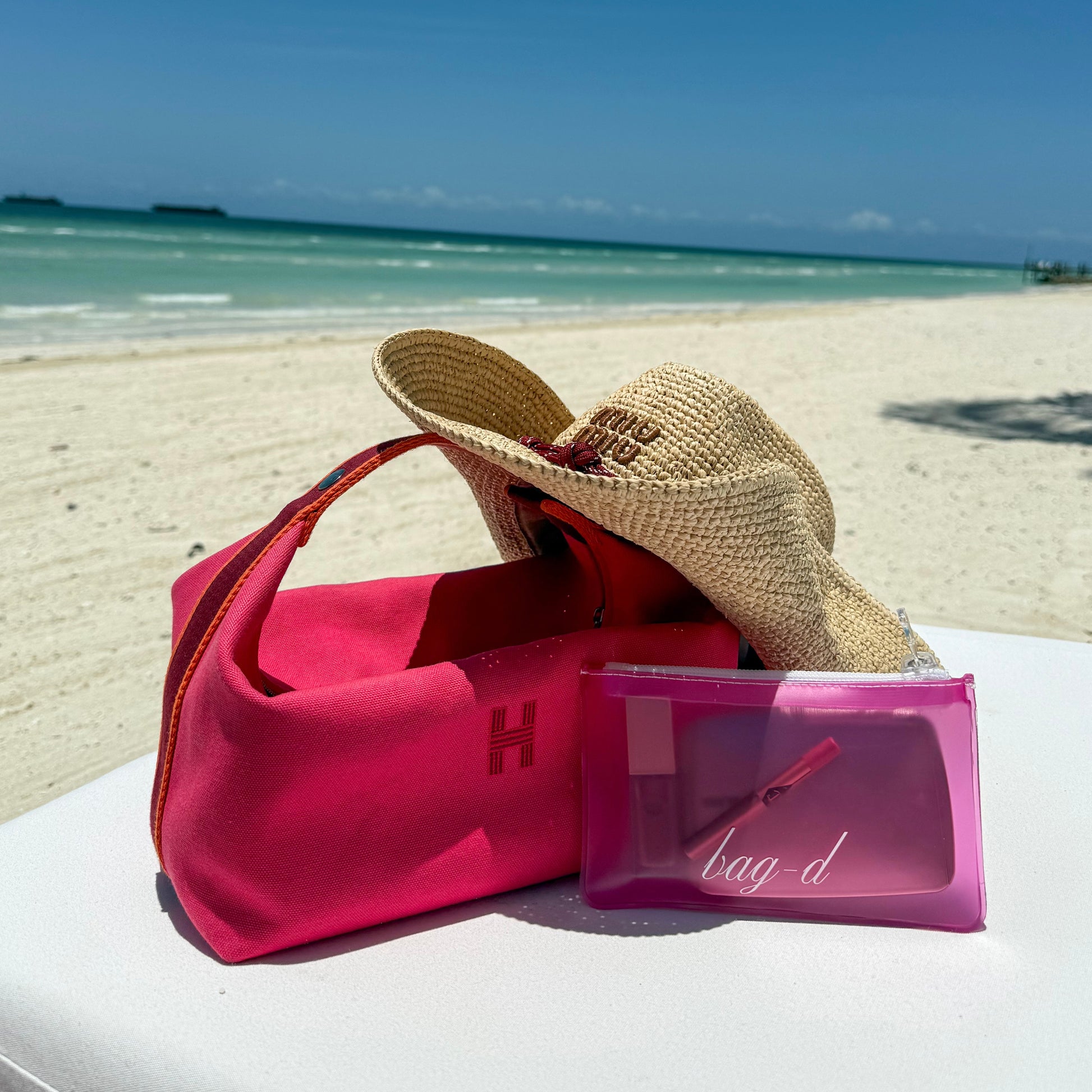bagd_everything_pouch_dark pink_tpu_front miu miu beach hat